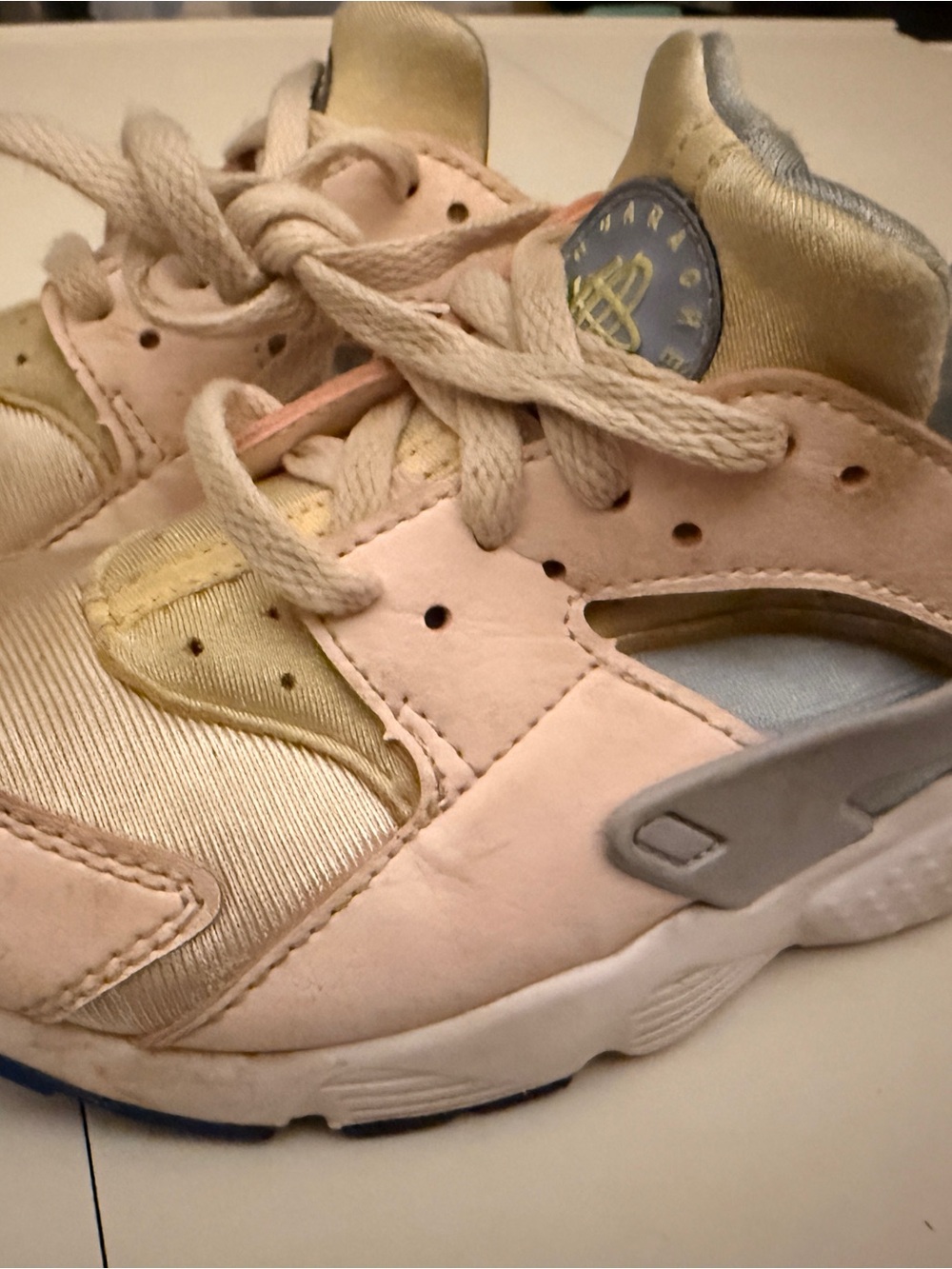 Nike Huarache Run in the 'Pearl Pink/Cobalt Bliss'